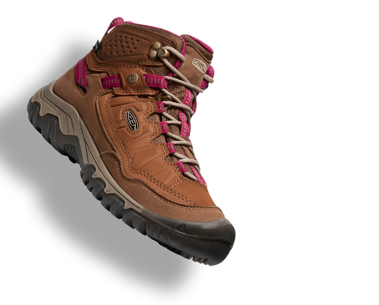 Product shot of women's brown and hot pink leather Targhee Hiking boot